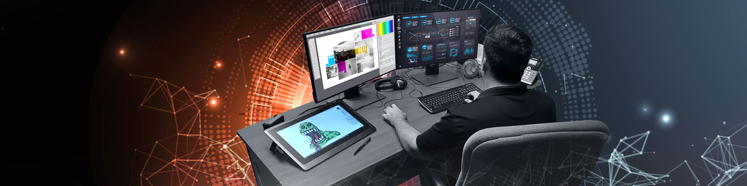 man working at computer on graphic design projects